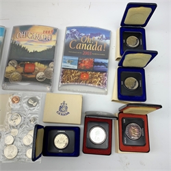 Commemorative Canadian coins and coin sets including five cased one dollar coins, 1972 coin set in presentation folder, various modern year sets in plastic cases etc