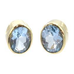Pair of 9ct gold oval blue topaz stud earrings, hallmarked