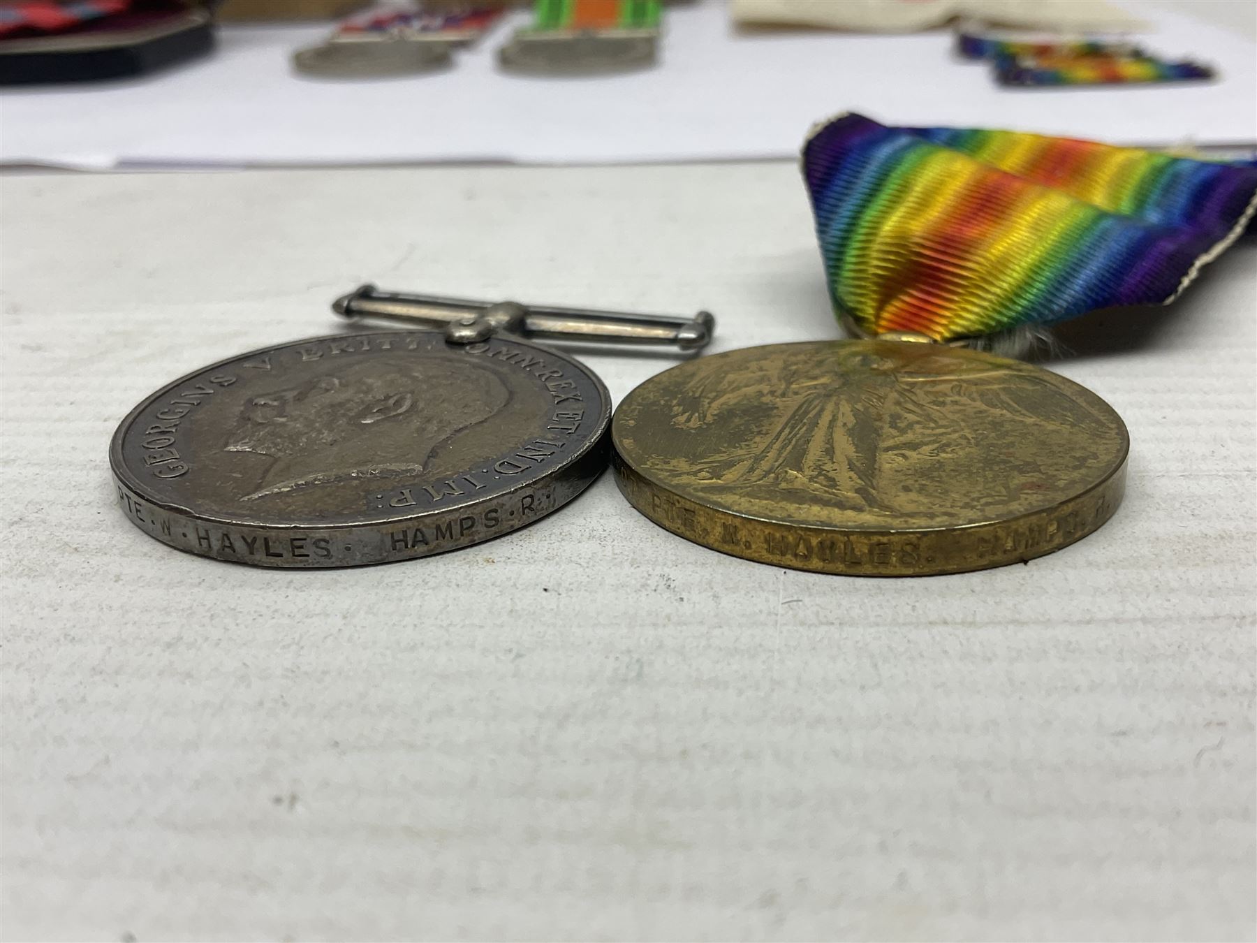 WWI pair of medals comprising British War Medal and Victory Medal awarded to 380807 Pte. W. Hayles Hamps. R.; Imperial Service Medal awarded to William Hayles; cased and boxed; WWII 1939-1945 War Medal and Defence Medal in issue box with slip; 1930s hallmarked silver football presentation fob etc