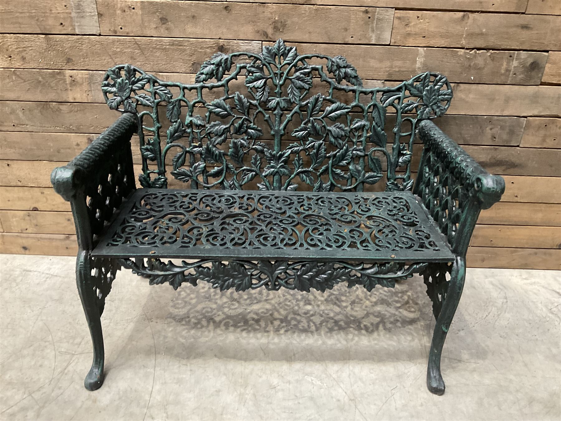 Victorian design heavy cast iron garden bench, ornate shaped back with rope twist and ramshead arms H88cm, W100cm
