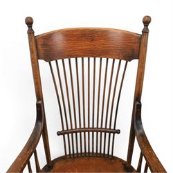 Set of eight 19th century ash and elm spindle back Windsor armchairs, arched top rails above fan-shaped spindle backs, curved arms with turned supports, shaped saddle seats, on turned legs joined by H-stretchers