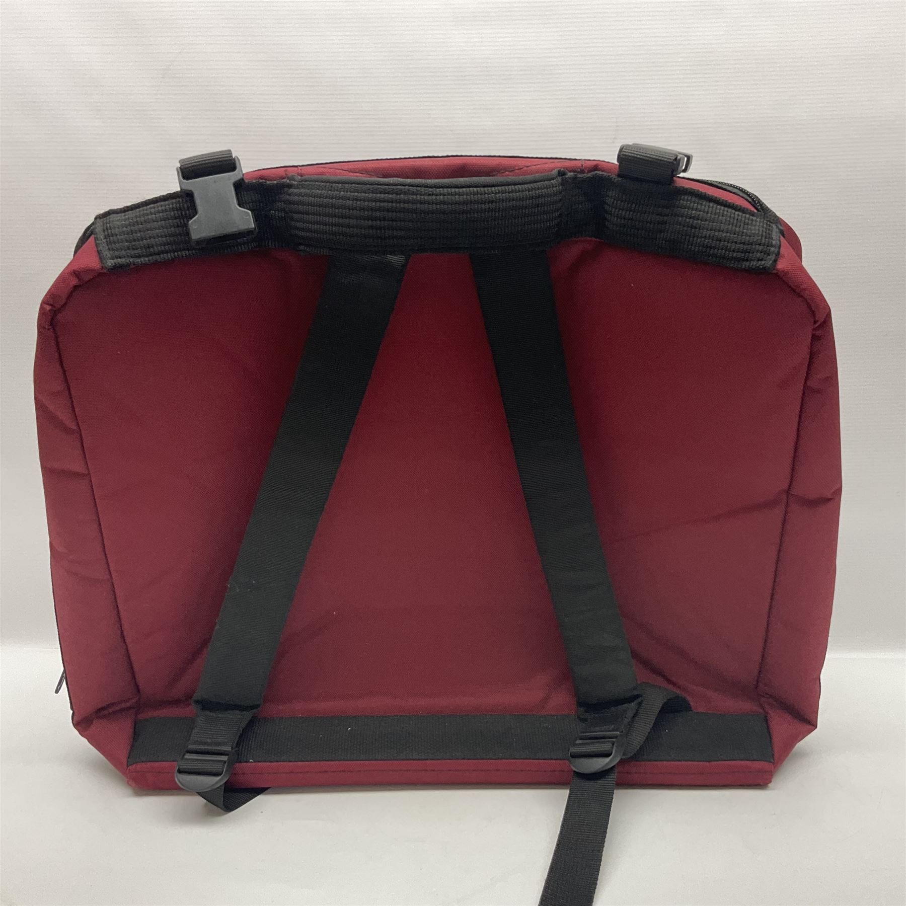 Hsinghai Studio piano accordion with red pearline finish, twenty keys and seventy-two buttons W44cm; in hard carrying case with additional The Music Room soft gig case