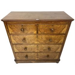 Early 20th century figured walnut chest, fitted with two short over three long drawers with bookmatch veneer facias, each with turned walnut handles, skirted base over compressed bun feet 
