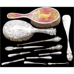 Collection of silver handled items including hair brushes, crochet hooks, nail files and shoe horn, all stamped or hallmarked