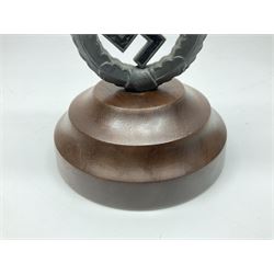 WW2 German cast white metal desk ornament/paperweight as the eagle insignia on later turned mahogany plinth H22cm