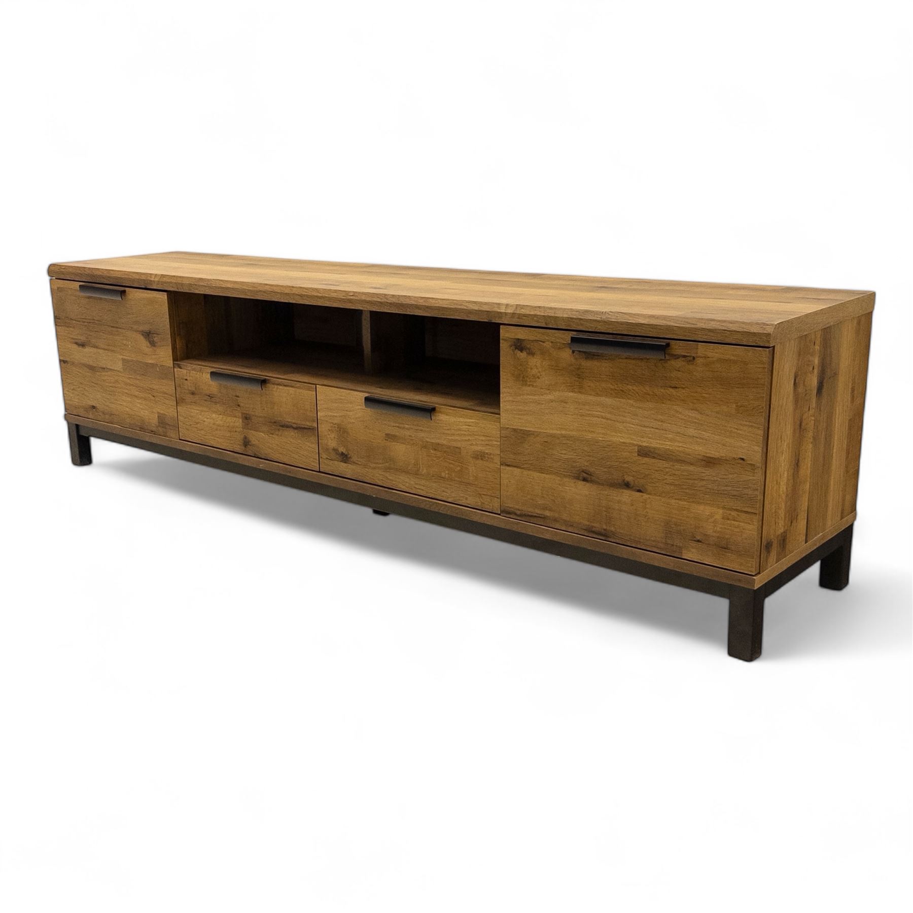 Pair of contemporary media sideboards, oak effect construction with inset handles, comprising two drawers and an open shelf flanked by cupboard doors, on metal supports (2)