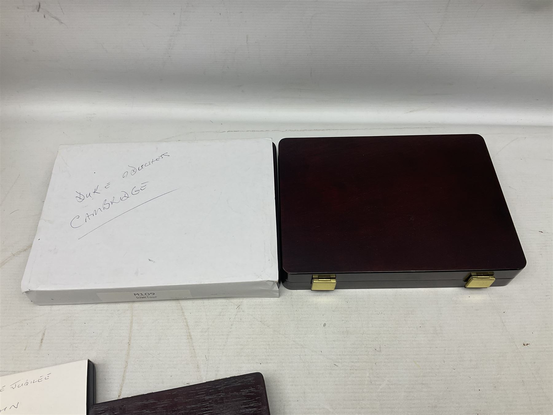 Mostly commemorative coins including The Royal Mint 1997 proof coin collection, Westminster 2013 'The Royal Baby Photographic 65mm' coin, Jubilee Mint 2017 'The Queen Elizabeth II Sapphire Jubilee' five pound coin collection etc