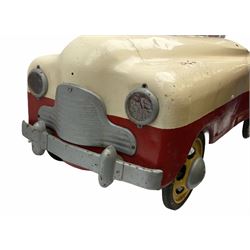 1950s child's tin-plate pedal car, possibly by Tri-ang, painted white and red and named 'Crusader' L104cm