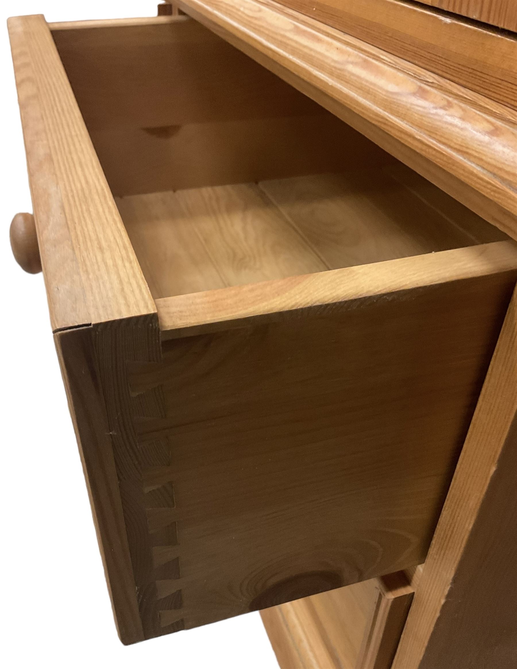 Solid pine double wardrobe, fitted with top box, enclosed by panelled doors, two short and one long drawer, on plinth base 