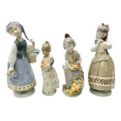 Four Lladro figures, comprising Miss Valencia no 1422, Girl from Valencia, Girl with Scarf no 5024 and Planning the Day no 5026, all with original boxes, largest example H18cm 