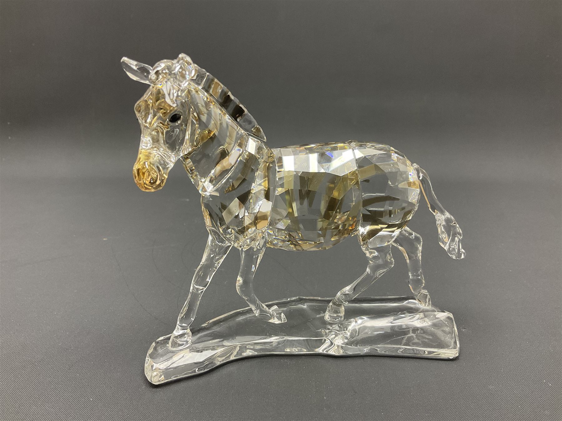 Swarovski Crsytal Society coloured animals, comprising zebra, giraffe and water buffalo, tallest H17.5cm