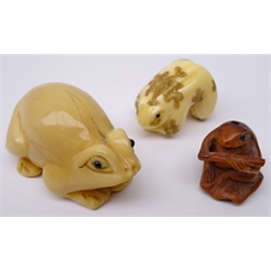 Japanese Meiji carved ivory Netsuke of a Frog with his arms & legs crossed, signed, boxwood Frog carved Ojime and another Frog shaped Netsuke (3)   