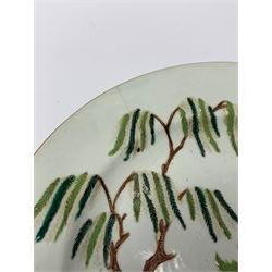 Three 18th Chinese plates, decorated in the Famille Rose pallet with various motifs including peonies, prunus blossom, willow, rockwork and fence, each approximately D13cm