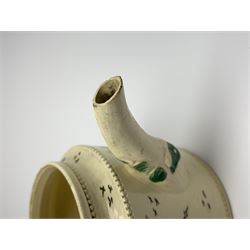 18th century creamware teapot, probably Leeds, with reeded entwined handle and floral finial to the cover, the body with hand painted polychrome decoration of figure to one side, and floral spray to the other, collectors paper label beneath inscribed Leeds Pottery, H11.5cm