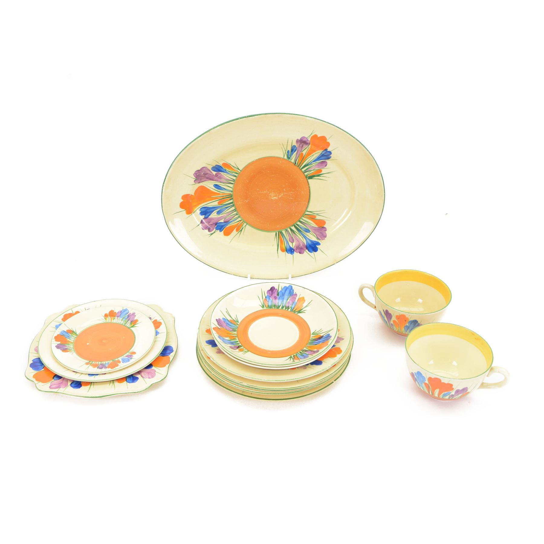 Clarice Cliff Crocus pattern dinner wares, including two teacups and saucers, five side plates, serving plate etc   