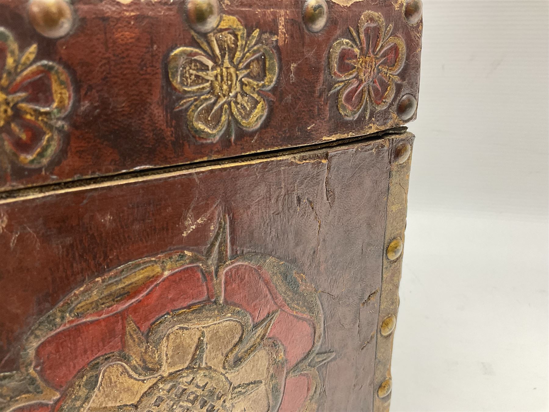 20th century box, decorated in faux leather with the royal coat of arms and GR 1719 to hinged cover, with fleur-de-lis, lion, crown and rose motifs throughout and studs to all edges, opening to reveal a purple velvet interior containing three removable wooden trays, H18.5cm