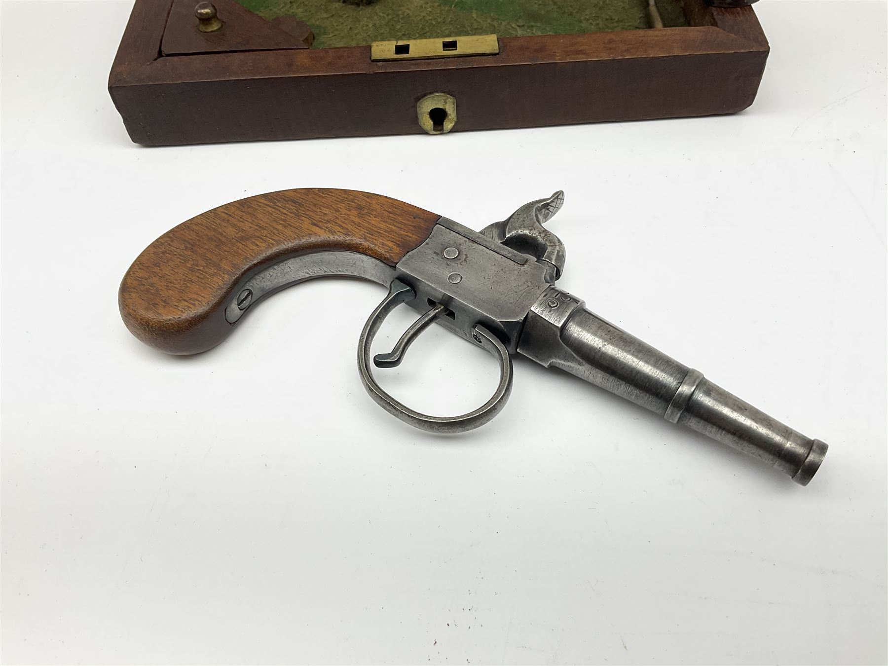 Scratch-built copy of a 19th century percussion cap pistol with 7cm tapering cannon style turn-off barrel, lock-plate inscribed 'F. Fox' and mahogany bag stock L17.5cm overall, in fitted mahogany box with inlaid crest chased mother-of-pearl cartouche and double-ended spanner