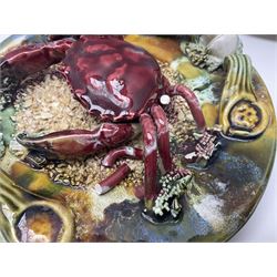 Five 20th Century Portuguese Palissy style Majolica wall plates, all depicting crustaceans to the centre modelled in relief surrounded by encrustations and shells, both with impress marks beneath, largest D29cm