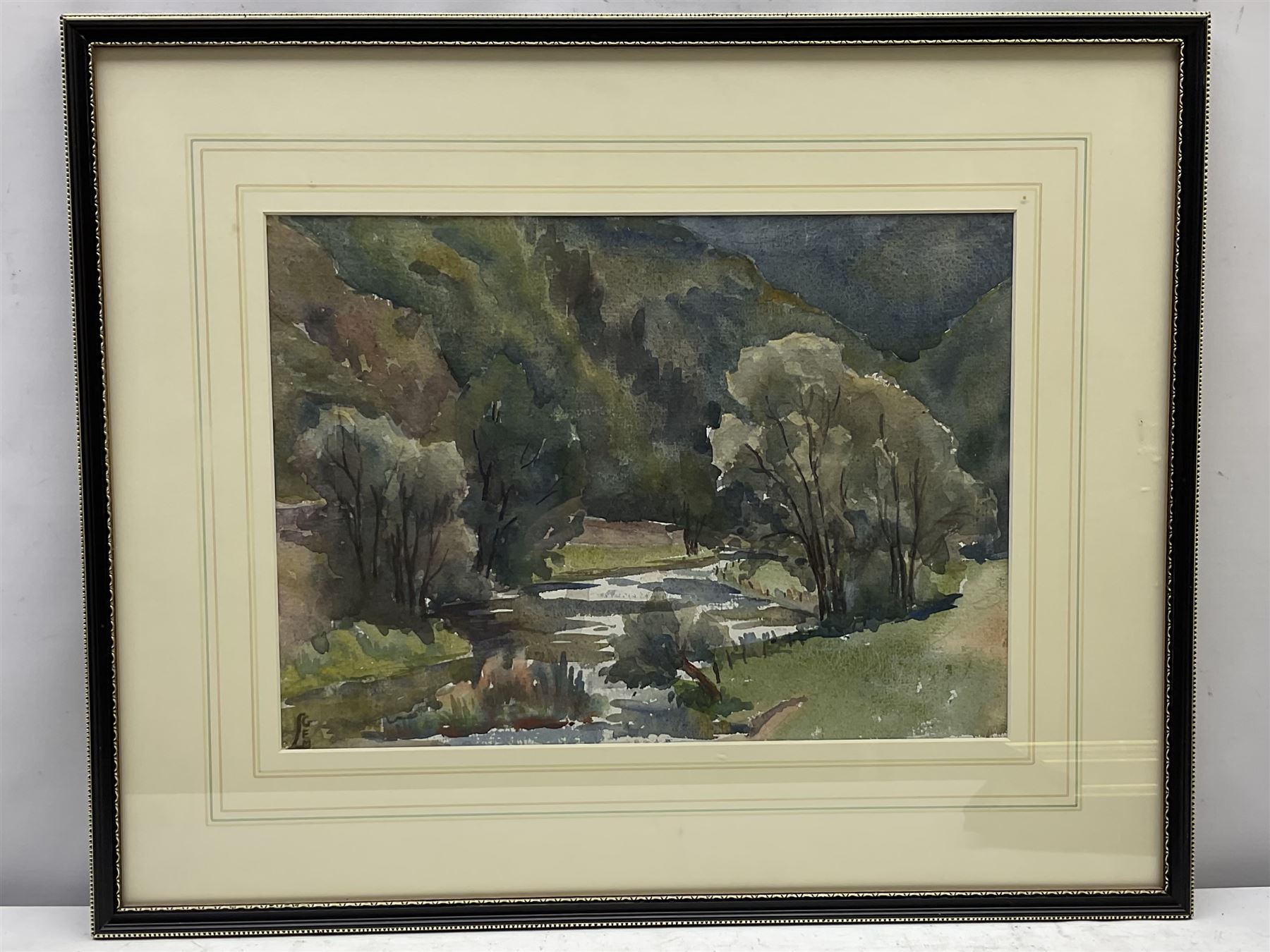 George Richard Lane Fox (1st Baron Bingley) (British 1870-1947): 'The Lake at Wothersome', watercolour unsigned, labelled verso 13cm x 22cm; Joan Ridout (British 20th century): 'Thorn Trees on Dartmouth', watercolour signed 22cm x 32cm; English School (20th century): Tree Landscape, watercolour signed with monogram 25cm x 35cm (3)