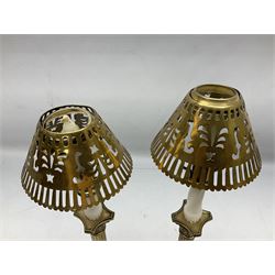 Two brass candlesticks modelled as Corinthian columns, with decorative pierced shades and square base, columns excl fittings H25cm