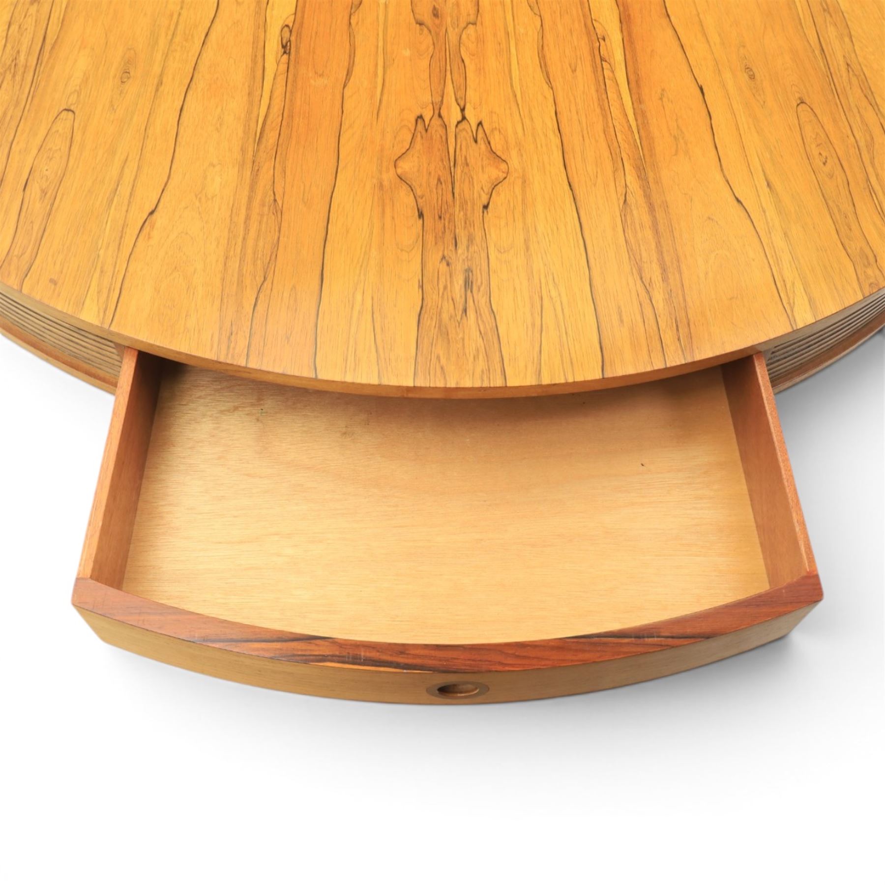 Robert Heritage for Archie Shine - mid-20th century santos rosewood drum table, circular top with four drawers with recessed handles, receded elements, raised on a cylindrical support with three legs