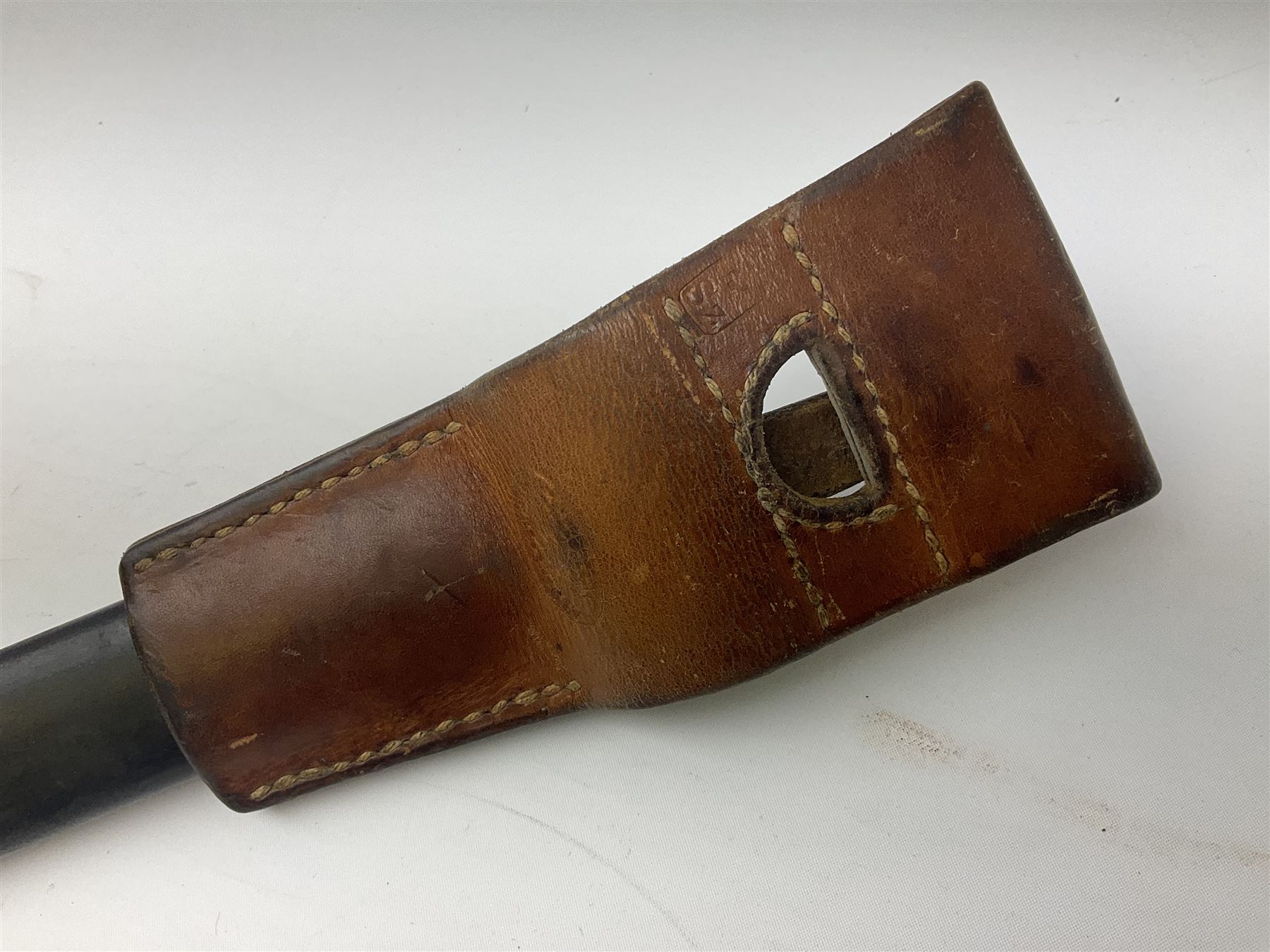 Swiss Schmidt-Rubin M1914 pioneer bayonet, with 48cm steel saw-back blade, the ricasso stamped, ''Waffenfabrik, Neuhausen'', the crosspiece stamped Swiss cross, steel scabbard, leather frog L64cm overall