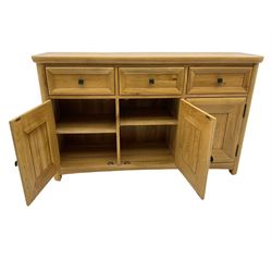 Solid light oak sideboard, fitted with three drawers and three cupboards