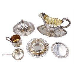 Early 20th century German silver table wares, comprising eleven soup cups and twelve saucers, six chocolate cups, twelve ramekin holders with tapering handles, large sauce boat with fixed stand, a butter dish and cover, and twelve side plates, each with wrythen or lobed detail, all marked with crown and crescent mark, and bearing other marks including 800 or 830, most marked A Roesner Dresden, the sauce boat marked Schnauffer Dresden, soup cups, cholate cups, ramekin holders and butter dish and cover all with ceramic or glass liners, approximate total silver weight 169.8 ozt (5281.8 grams)


