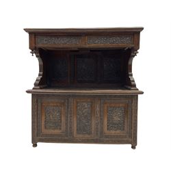 Early 20th century oak buffet side cabinet, the raised back with moulded top over two drawers, three panel back and two cupboards under, raised on turned supports, profusely carved with foliate all over W123cm, H126cm, D49cm
