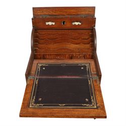 Victorian oak perpetual calendar roll-top desk, tambour front enclosing fitted interior with pigeonholes and pen trays, the raised back fitted with rotating date and month apertures, over single frieze drawer with cast brass handle, on plinth base