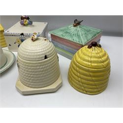 Clarice Cliff for Wilkinson Ltd Crocus Bizarre beehive honeypot painted in the Crocus pattern, together with two beehive Beswick honey pots, Poole square honey pot etc (14)