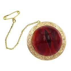 Early 20th century gold circular orange agate brooch by Constantine & Floyd Ltd, stamped 9ct