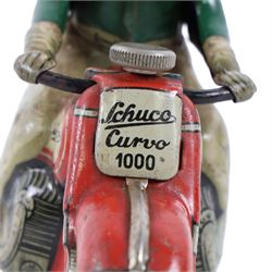 Schuco Curvo 1000 tinplate clockwork motorcycle, in red and cream, with rider in green jacket