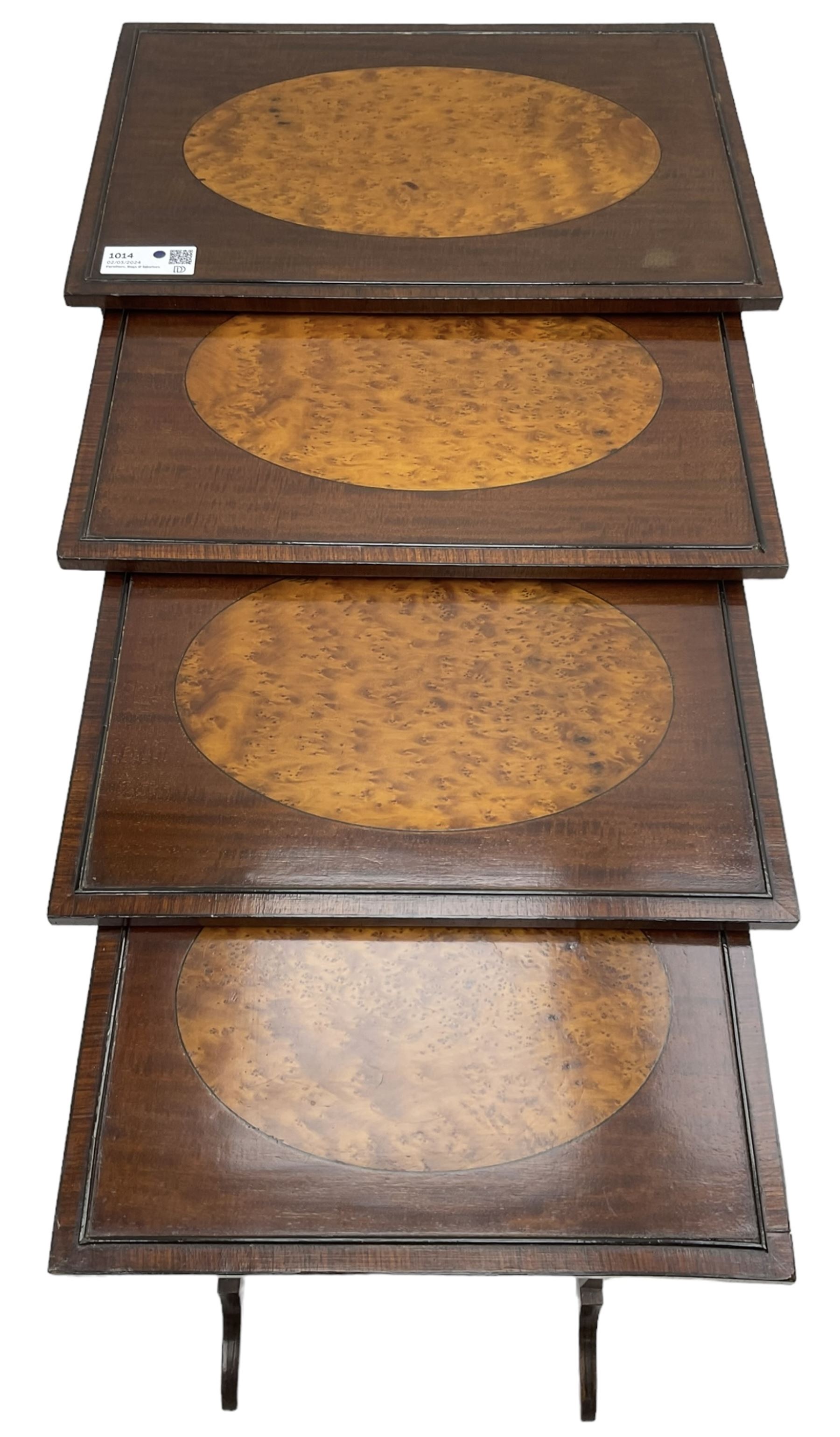20th century inlaid mahogany quartetto nest of four tables, rectangular top inlaid with birdseye maple oval panel, ring turned supports on sledge feet