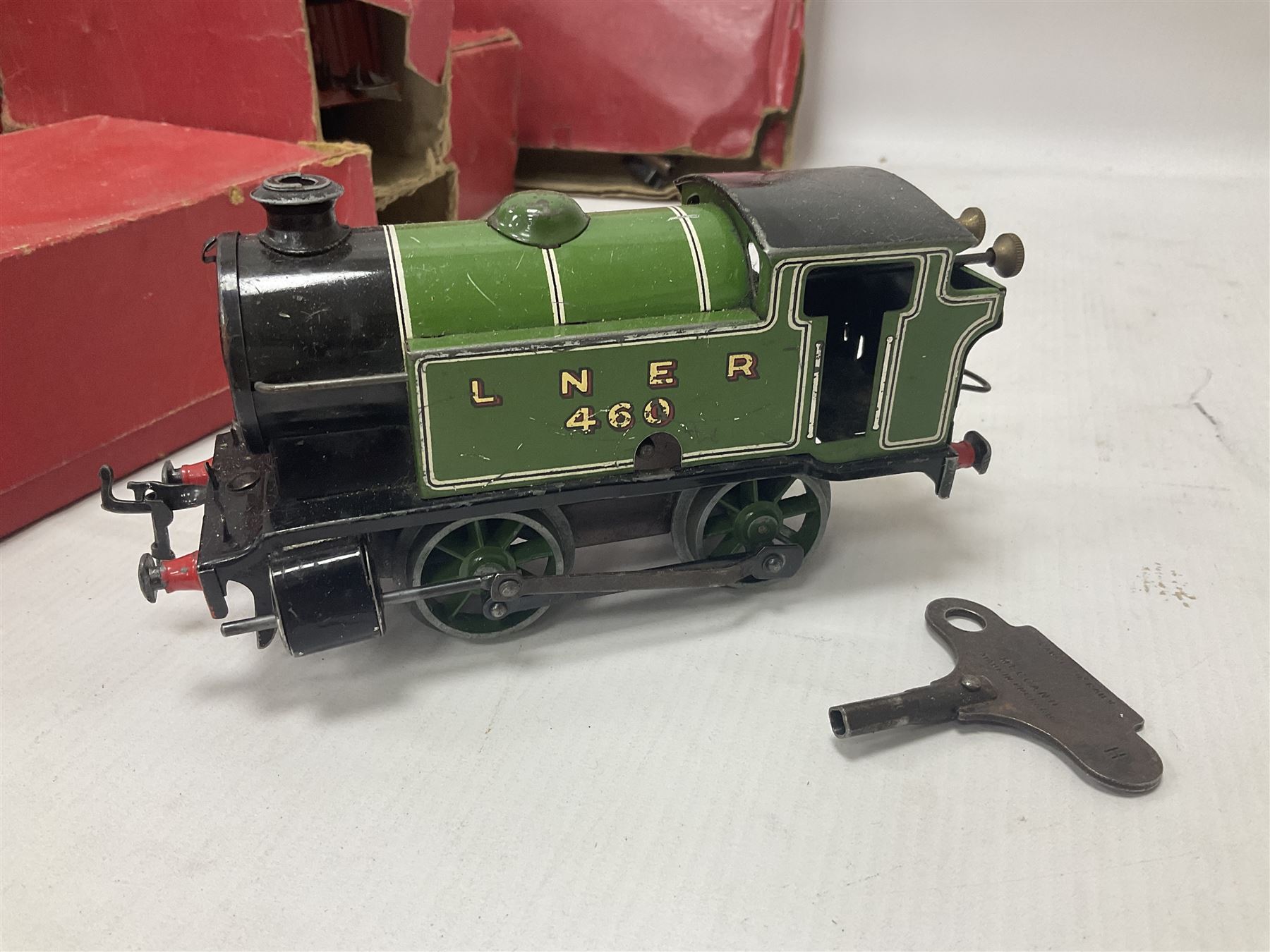 Hornby ‘0’ gauge - LNER 0-4-0 no.460 type 101 locomotive in green with key; further boxed ‘0’ gauge to include no.1 Crane Truck, no.2 single arm signals, open and closed goods wagons and cars; large quantity of track to include railway crossing, straight and curved track etc, in two boxes 