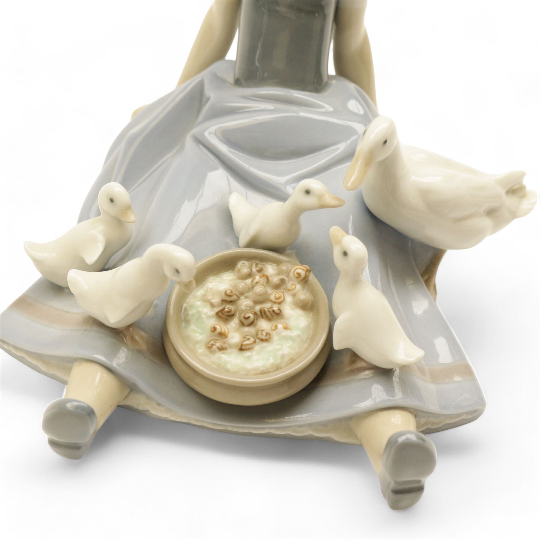 Two Lladro figures, comprising My Hungry Brood no. 5074 and Girl with Turkey no 5066