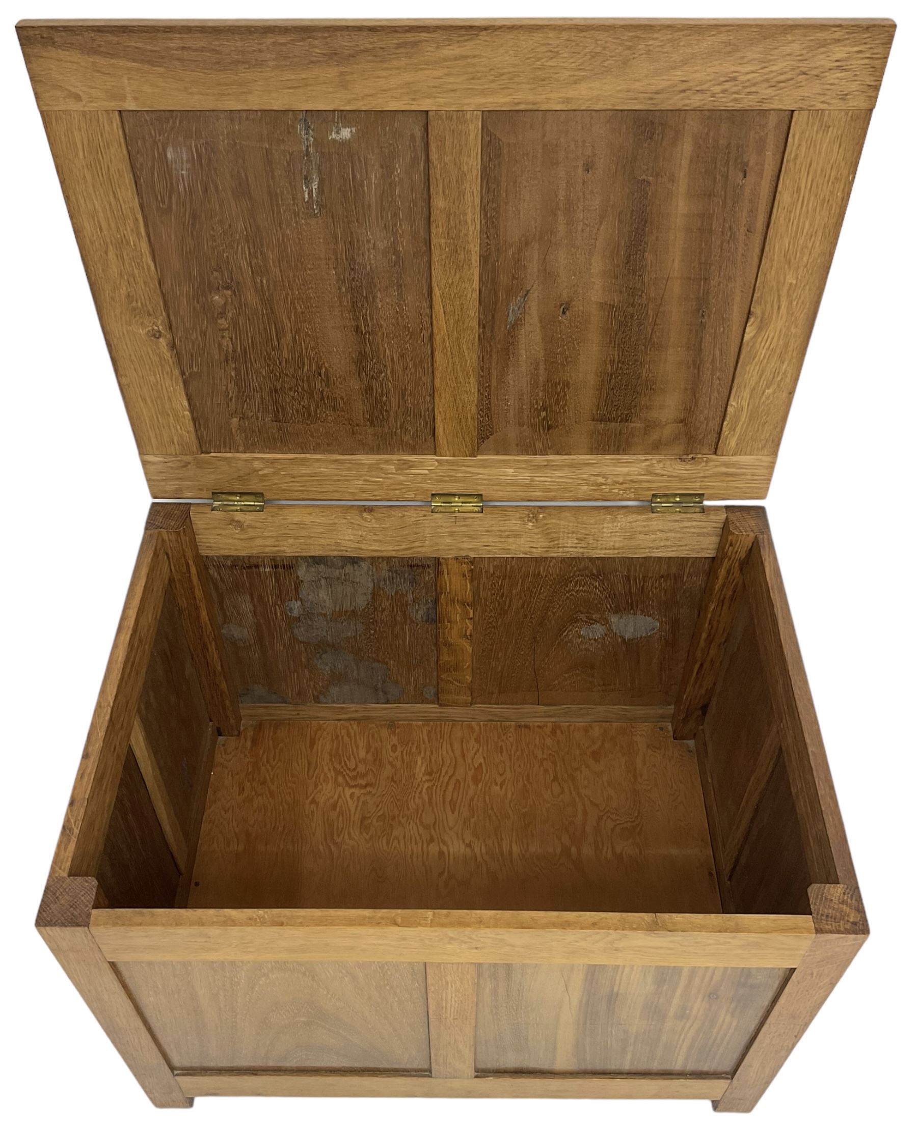 20th century panelled oak blanket chest, rectangular hinged top, raised on square supports