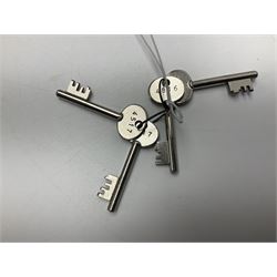 Two-tone grey steel wall-mounting gun cabinet by Sambell Engineering to accommodate six guns with fixed shelf over, gun space int. H132cm W36.5cm D23.5cm, the single double-locking door with two sets of keys, ext. H154cm W37cm D27cm