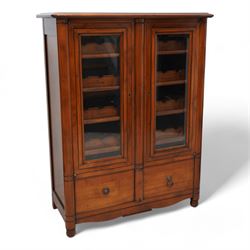 Cherrywood wine rack cabinet, moulded rectangular top over two glazed doors, fitted with eight slides each with three bottle holders inscribed with various wine types, single long drawer to the base 