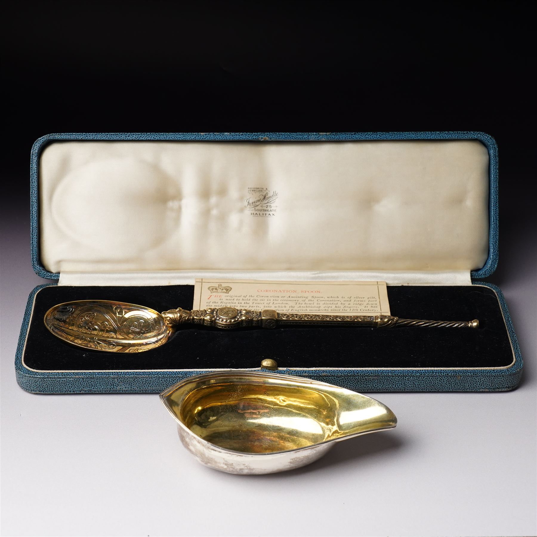 George III silver pap boat with gilded interior London 1799 and a silver gilt copy of the Coronation spoon, cased L25cm London 1936 Maker Wakely & Wheeler