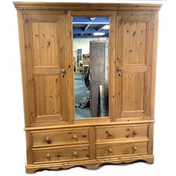 Solid pine triple wardrobe with four drawers, centre mirror