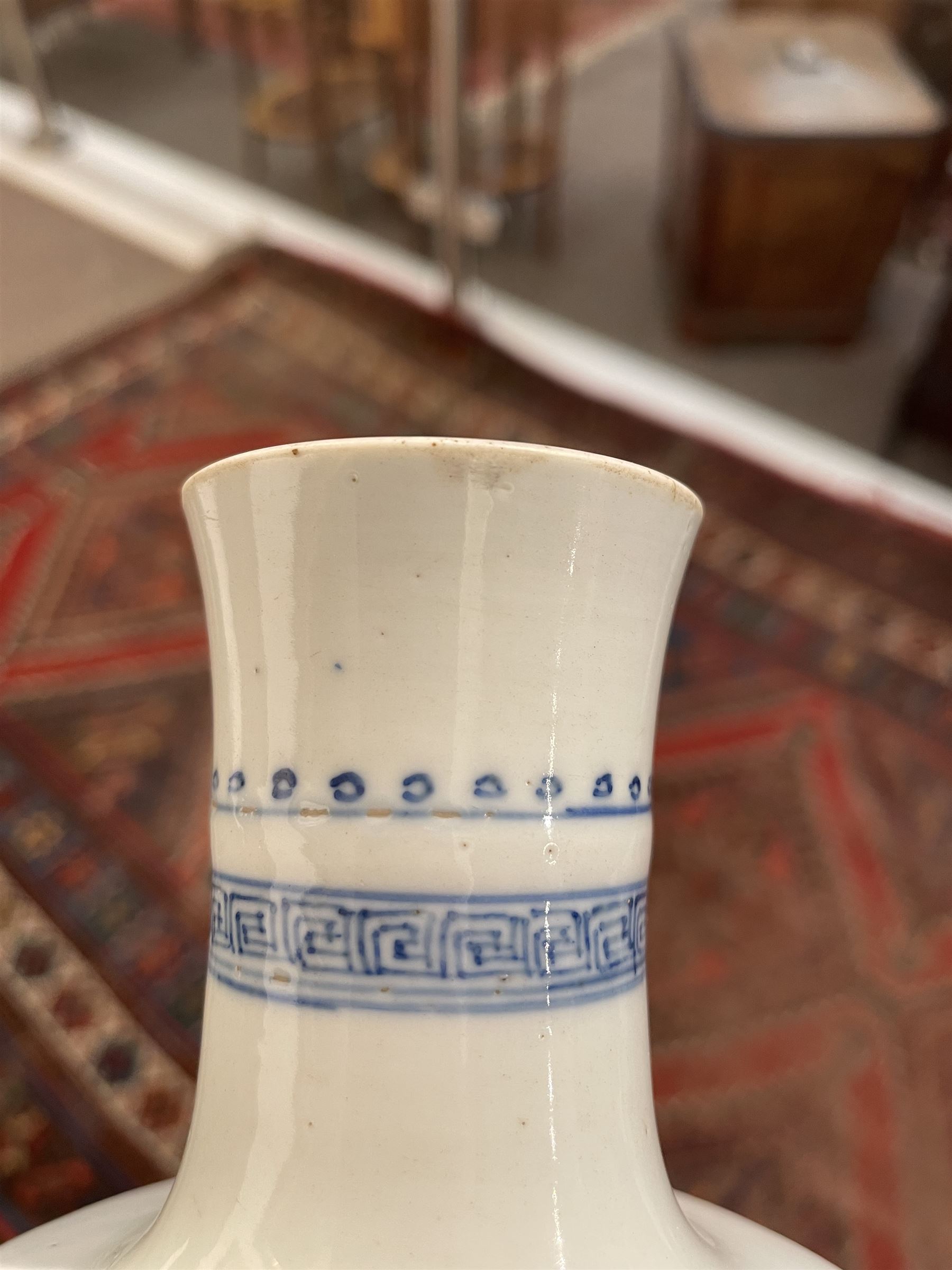 Chinese Kangxi porcelain vase, of baluster form painted in underglaze blue with seated figures and attendants, with fence, rockwork and leafy bamboo branches, with concentric circles mark beneath, H22.5cm