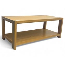 Light oak rectangular coffee table, with exposed finger joints to the corners, raised abov...