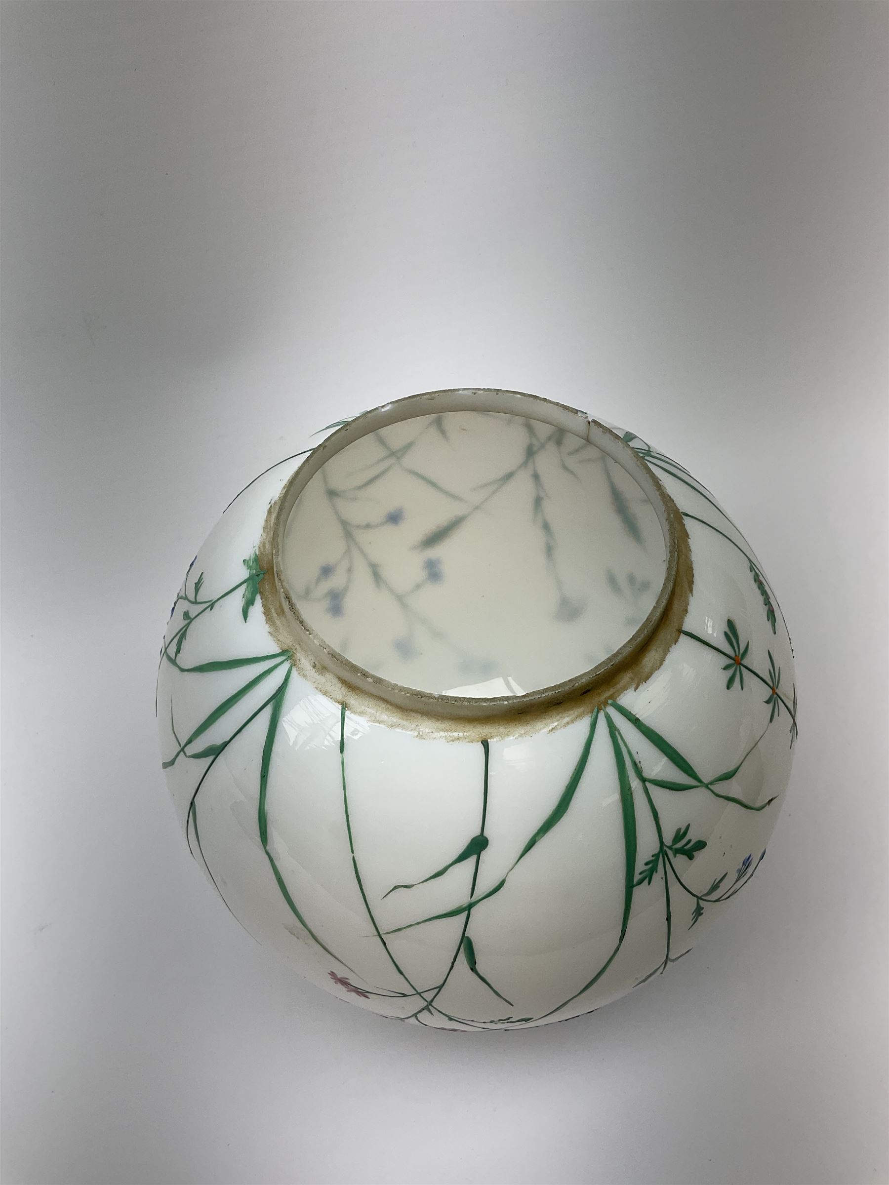 A Victorian oil lamp, with opaque glass reservoir hand painted with flowers beneath a Hinks burner and supporting a globular floral painted opaque glass shade and glass chimney, H47.5cm. 