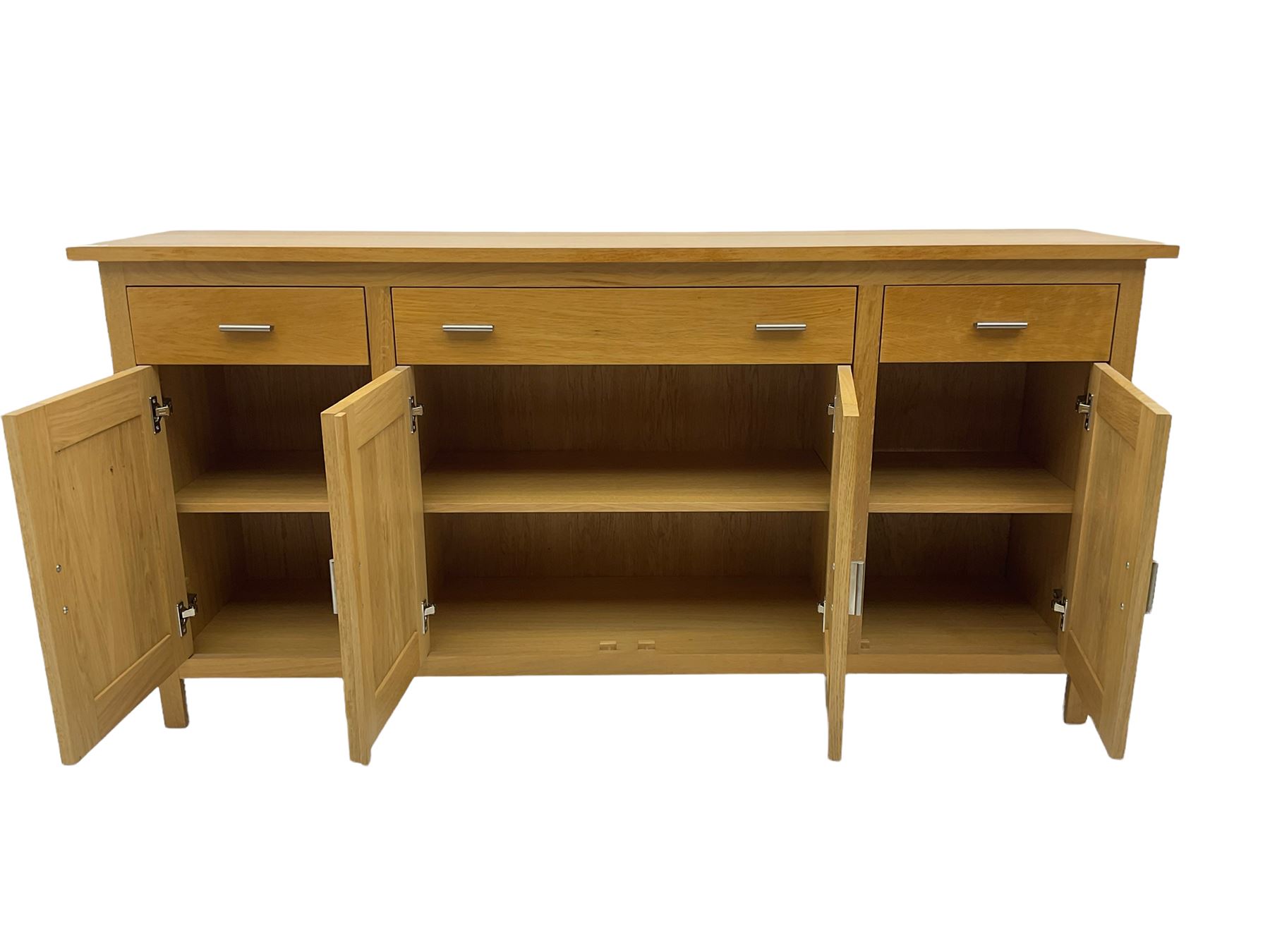 GPlan light oak sideboard, fitted with three drawers and four