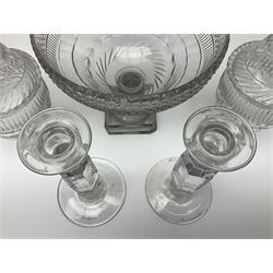 19th century and later glassware, comprising cut glass pedestal sweetmeat bowl, with hobnail cut decoration, upon knopped stem and square stepped foot, together with a pair of cut glass sweetmeat jars and covers, each upon faceted stem and square stepped foot, the cut glass domed covers with conforming faceted finials and a pair of heavy glass candlesticks, each upon faceted knopped stem and circular spreading foot, tallest H32.5cm