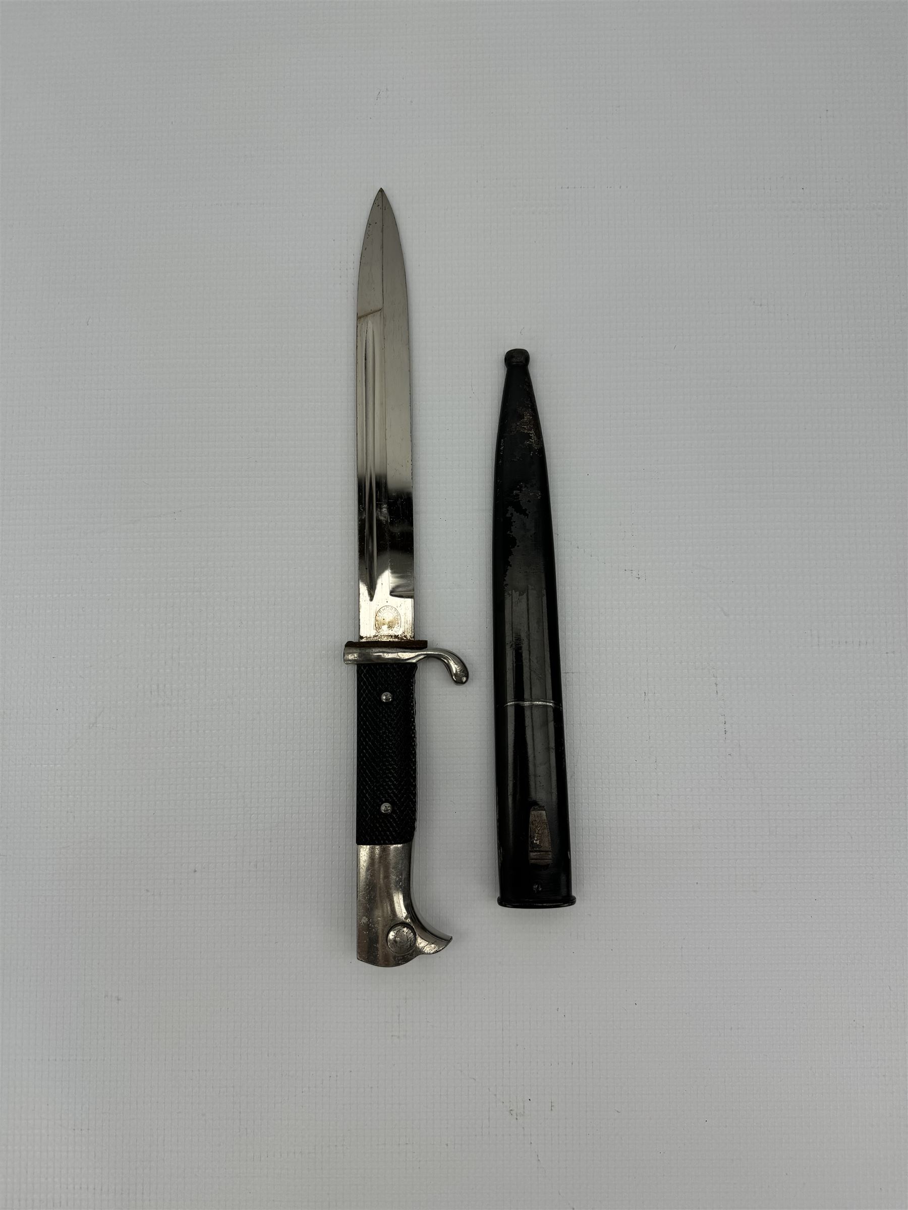 German Third Reich bayonet, the steel blade stamped E & F Horster, Solingen with black plastic chequered grip scales, L35cm