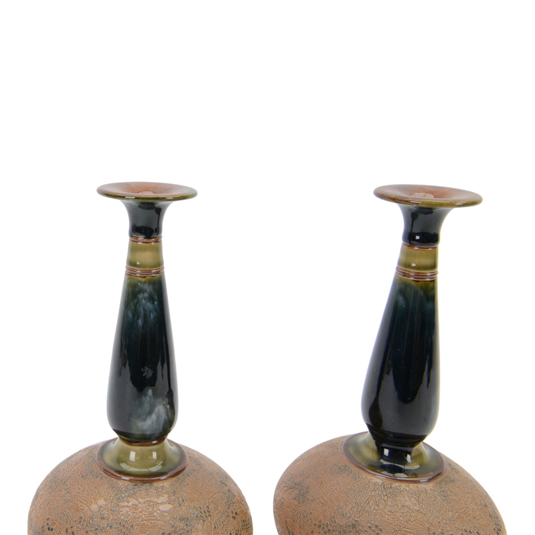 Pair of Royal Doulton vases by Christine Abbot, of squat circular form with elongated neck and flared rim, the body decorated with floral design, H26cm