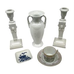 Group of Royal Copenhagen ceramics comprising pair of late 20th century fluted candlesticks of Neoclassical form, the tapering stems with lion masks and husk swag detail, H25.cm, Mulberry Hall, York teacup and saucer decorated with Astragalus arenarius, twin handled white vase of slender baluster form and small square dish, all with printed or painted marks beneath (5)