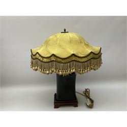 Blanc de Chine style table lamp with pierced foliate decoration, on a hardwood base, with a blue fabric shade, H36cm, together with black lacquered Chinese headrest, converted into a lamp, on a hardwood base, with yellow oval shade with tassels H50cm. .  